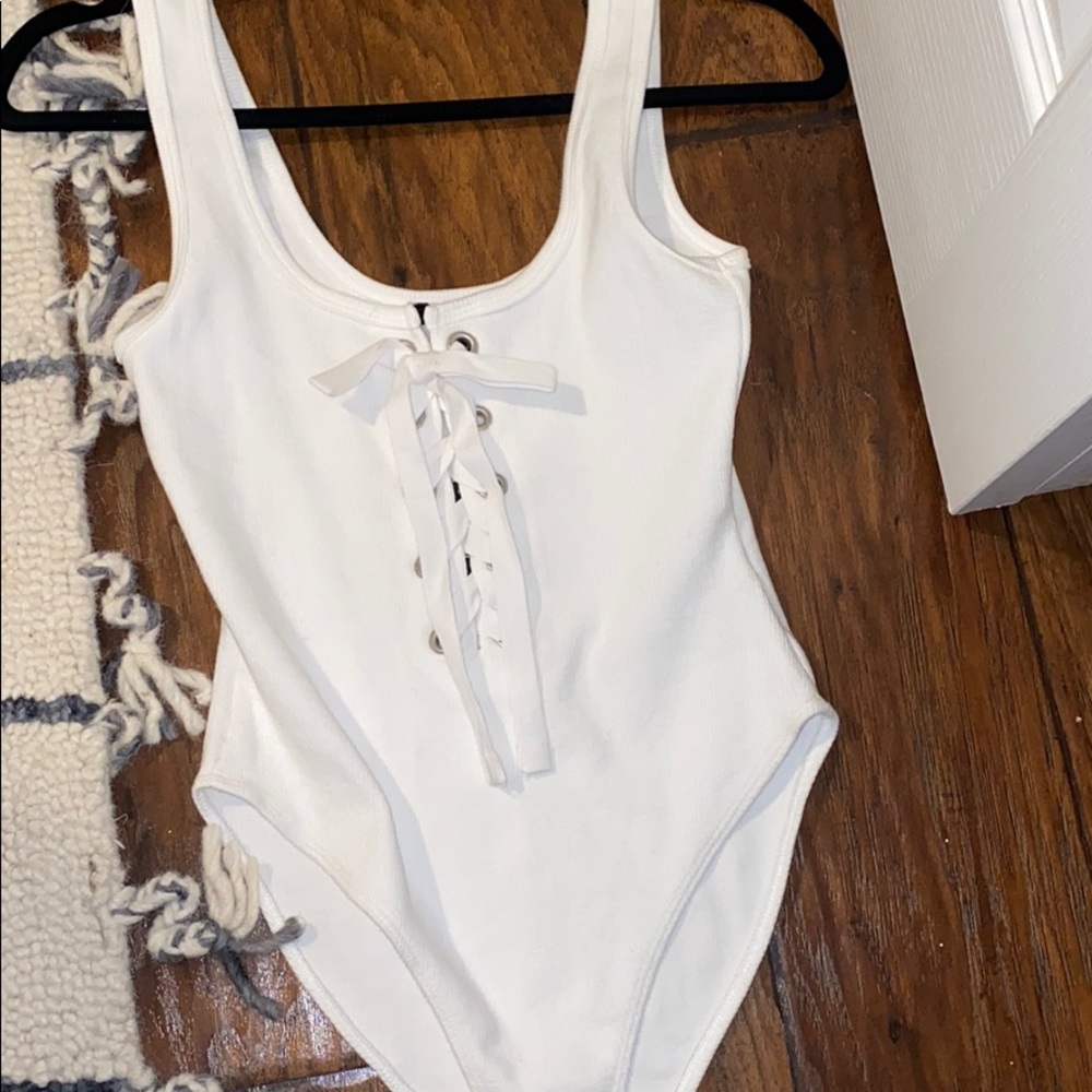 White ribbed lace up body suit